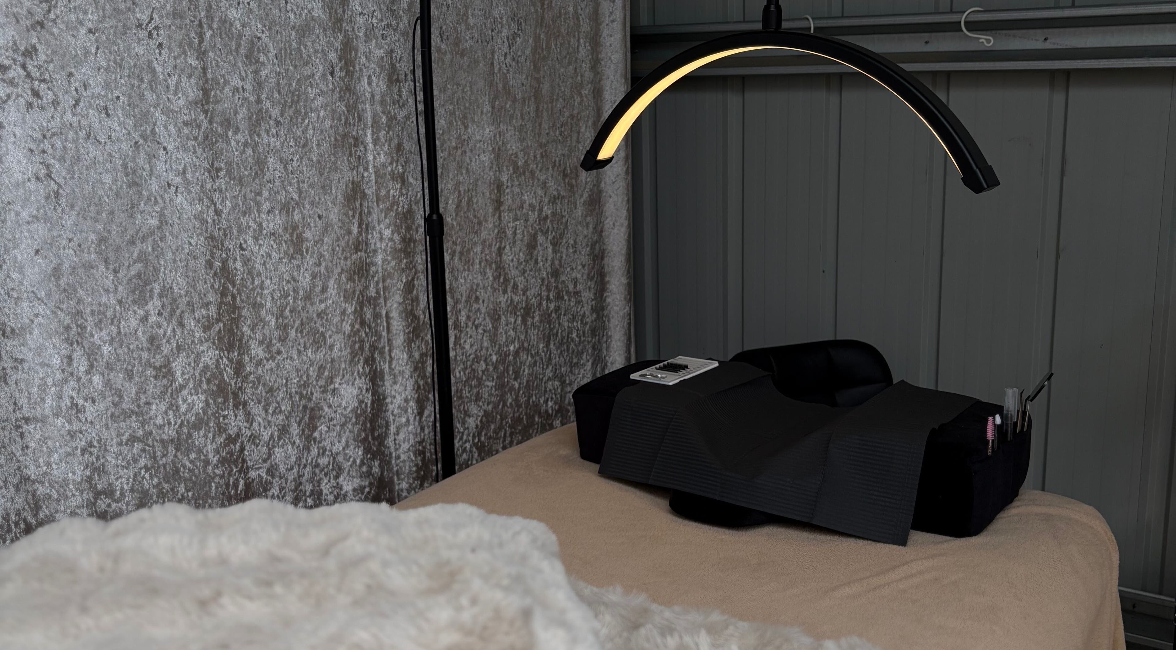 Comfortable beauty treatment area at Lashed By Mirai in Ravenswood, Tasmania, AU with gentle lighting.