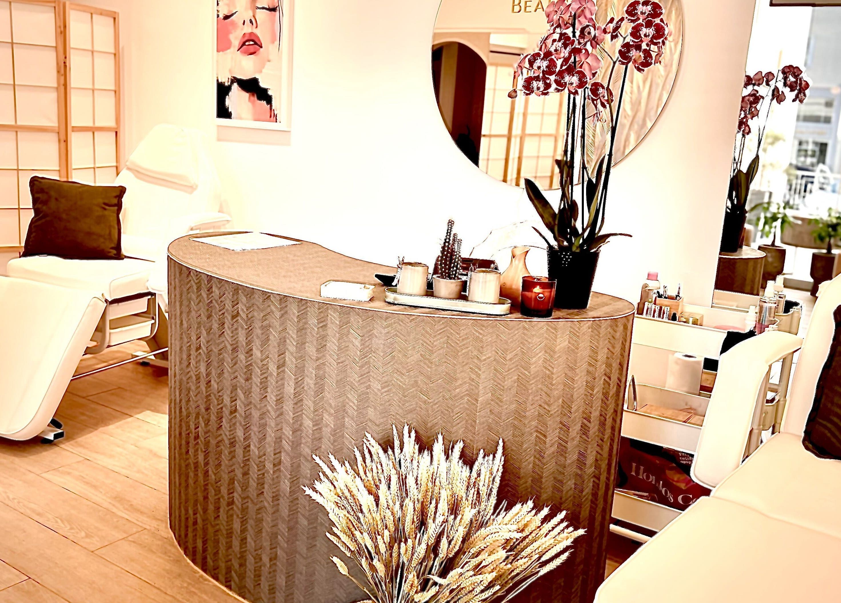 Relaxing interior of Aether beauty nails in Glifada, GR featuring spa chairs and elegant decor.