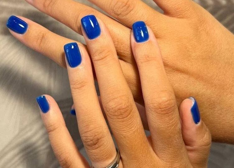 Vibrant blue nails at Aether beauty nails, Glifada, GR, showcasing modern manicure artistry.