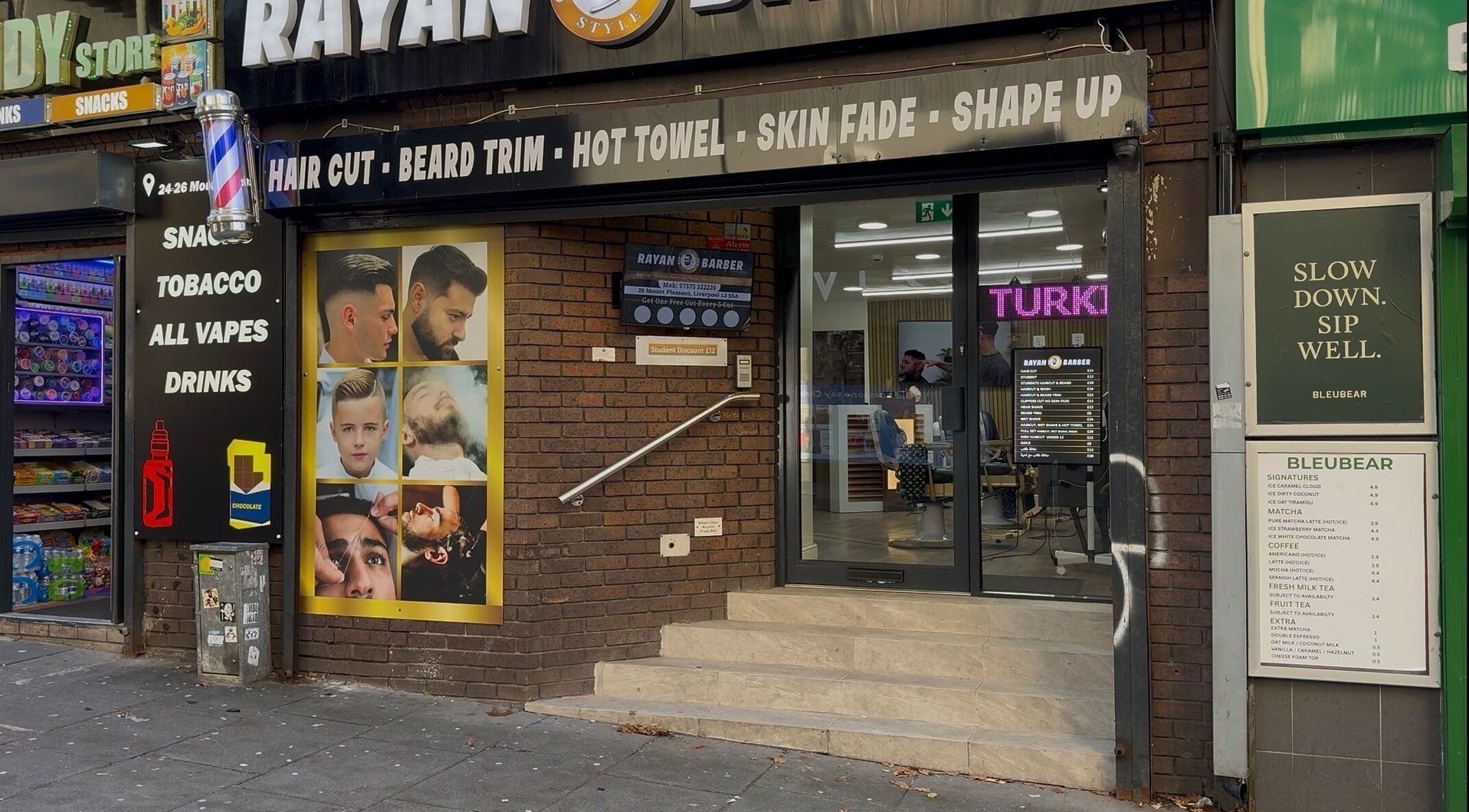 Front view of Rayan Turkish Barber showing entrance and signage in Liverpool, England, GB.