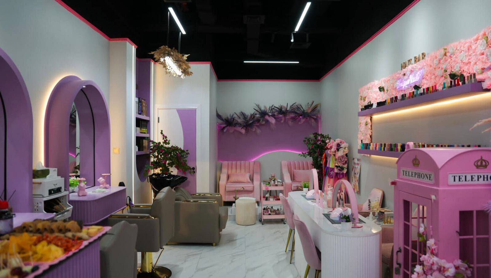 Chic interior of Unique Station Beauty Salon in Dubai, AE, featuring elegant lavender decor and plush seating.