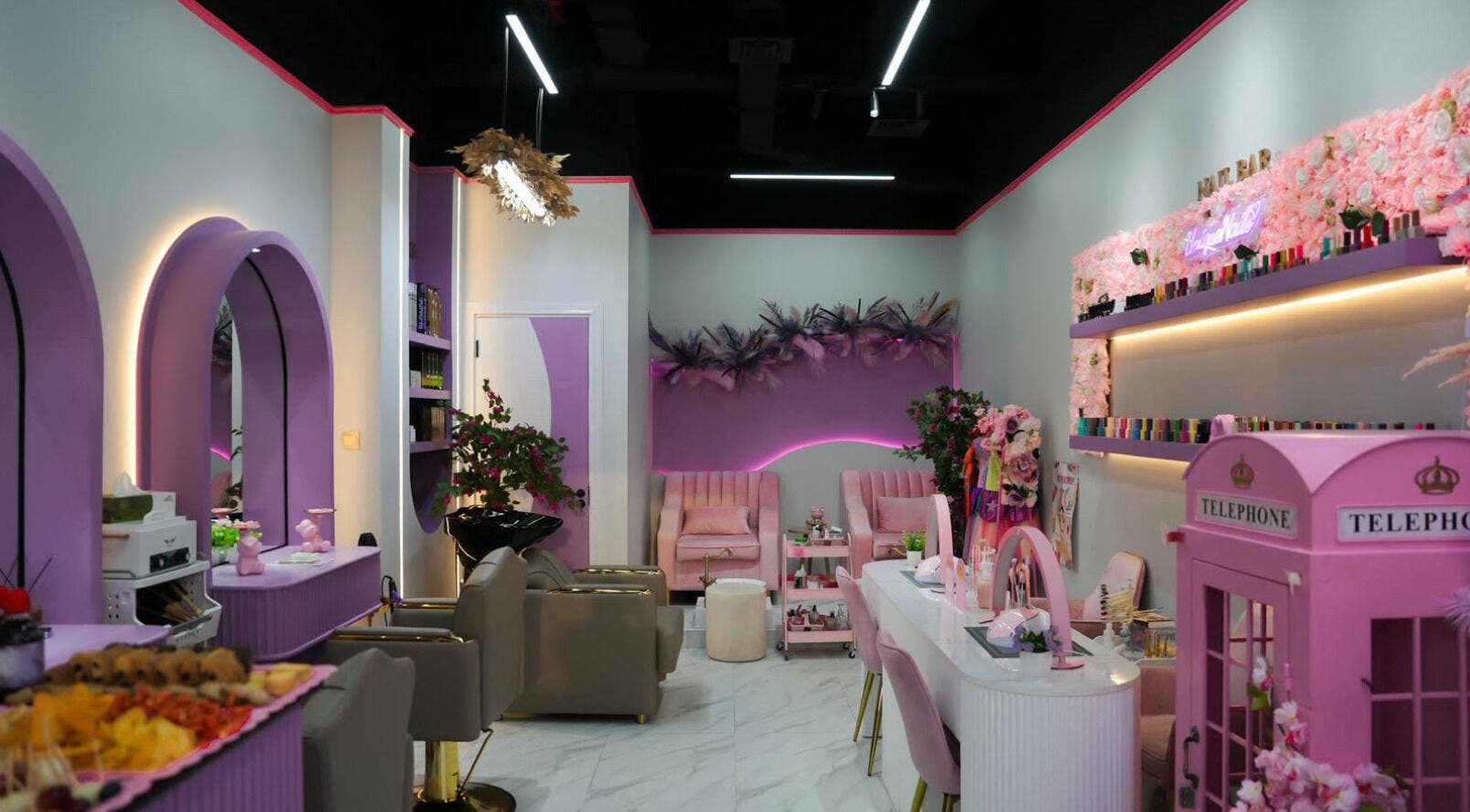 Chic interior of Unique Station Beauty Salon in Dubai, AE, featuring elegant lavender decor and plush seating.