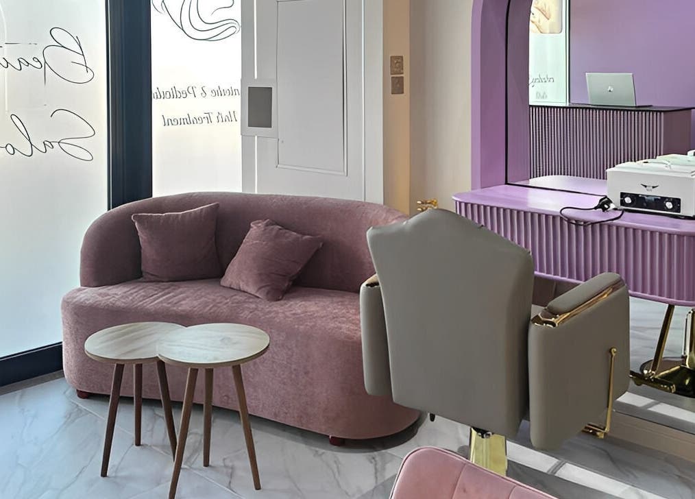 Interior of Unique Station Beauty Salon, Dubai, AE featuring stylish furniture and modern decor.