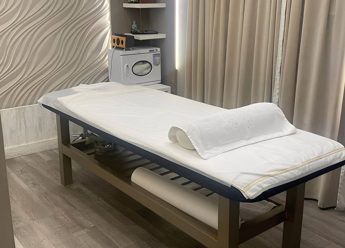 Relaxing treatment room at Firgunwellness Yerevan, Yerevan, AM with massage table and tranquil decor.