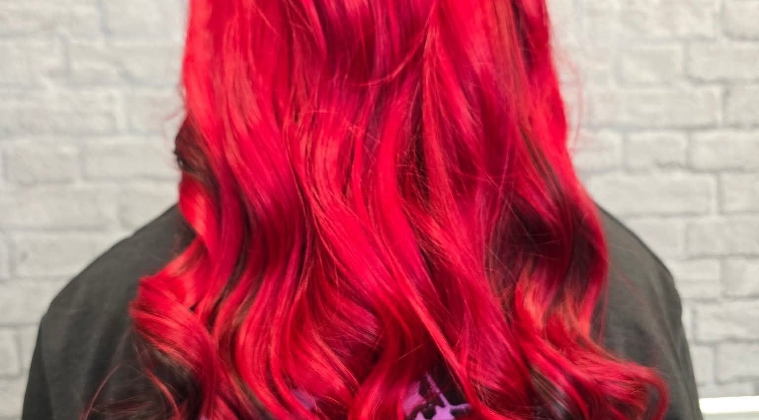 Dynamic red hair styled in flowing waves at Stephs Styles, Johnstone, Scotland, GB.