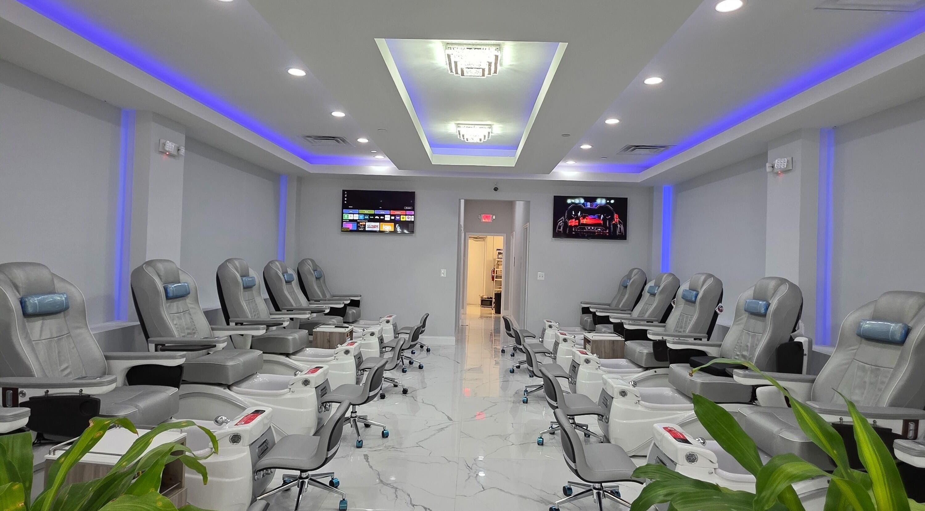 Elegant salon setup at Luminous Nails Bar, Pasadena, Maryland, US, featuring modern pedicure chairs and ambient lighting.