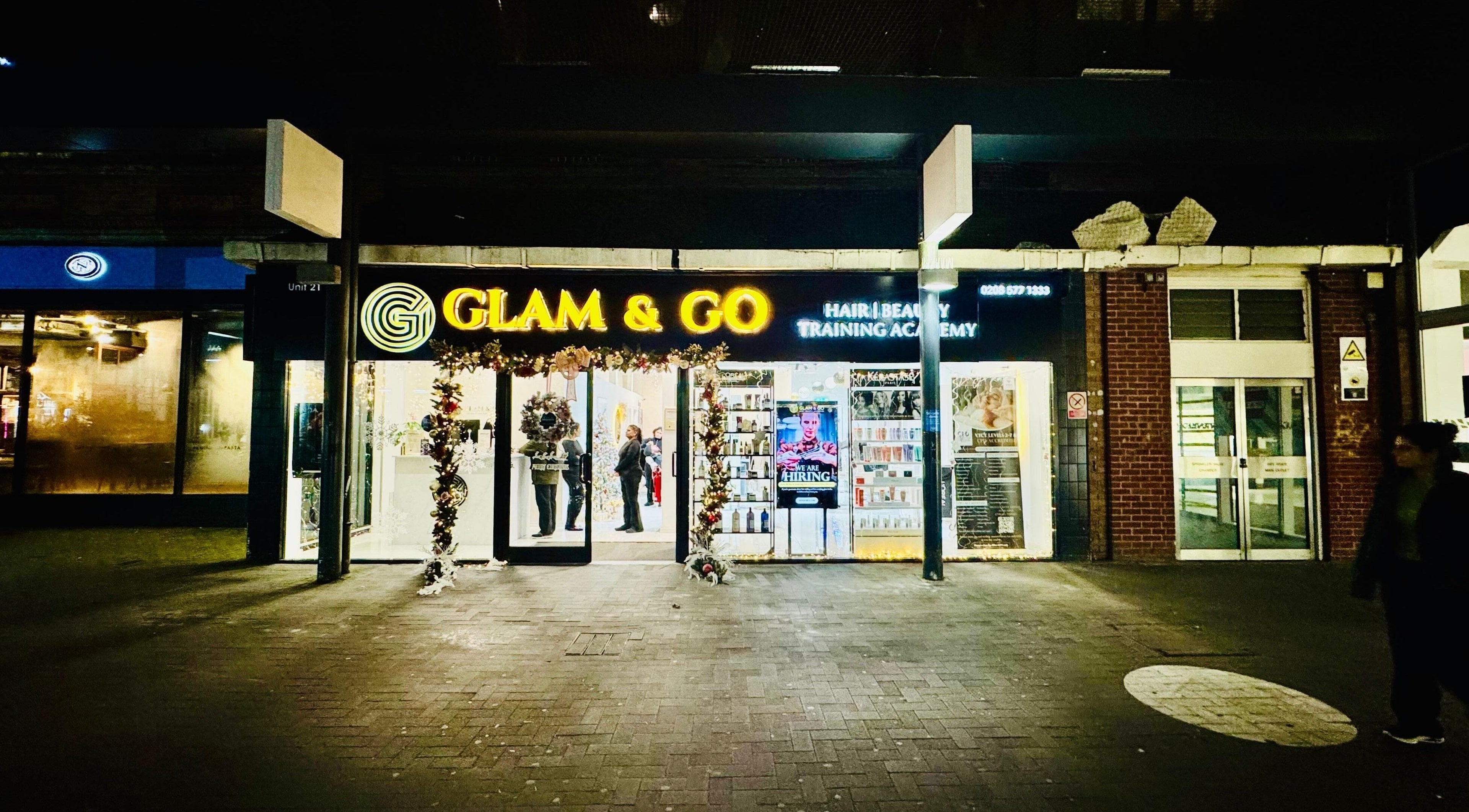 Glam & Go Hounslow entrance lit at night, showcasing beauty services in Hounslow, England, GB.