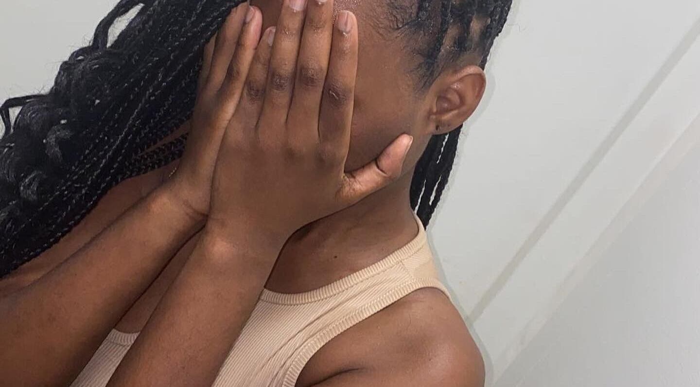 Close-up of a person with braided hair covering their face at Connecture Canada, Mississauga, Ontario, CA.