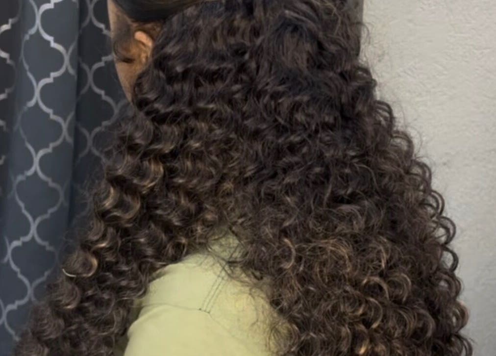 Luxurious curly hairstyle at Enchanted Looks Studio, Georgetown, Demerara-Mahaica, GY. Transform your look today.