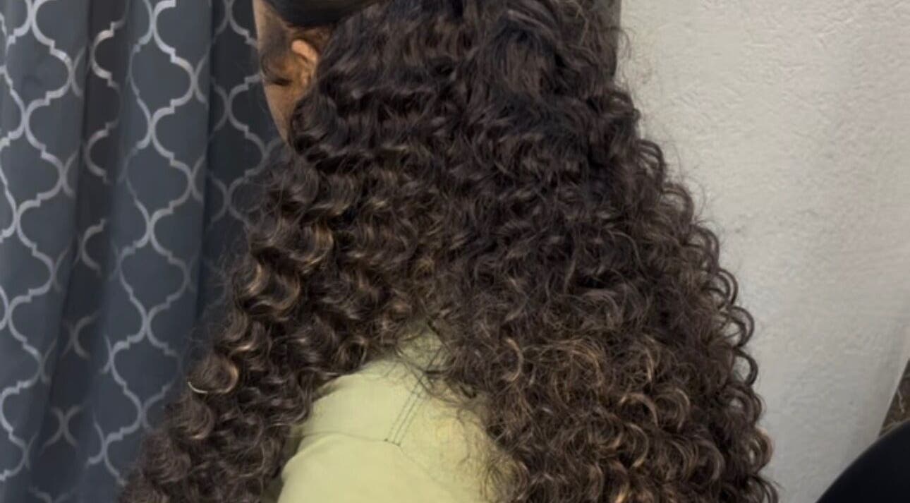 Luxurious curly hairstyle at Enchanted Looks Studio, Georgetown, Demerara-Mahaica, GY. Transform your look today.