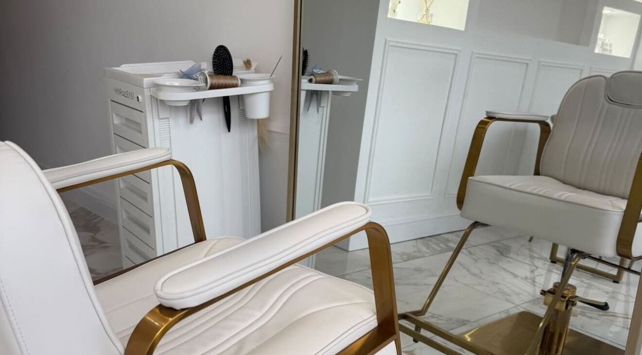 Luxurious salon setup at Hair By Maddison, Tynemouth, England, GB, featuring a chic white chair and styling tools.