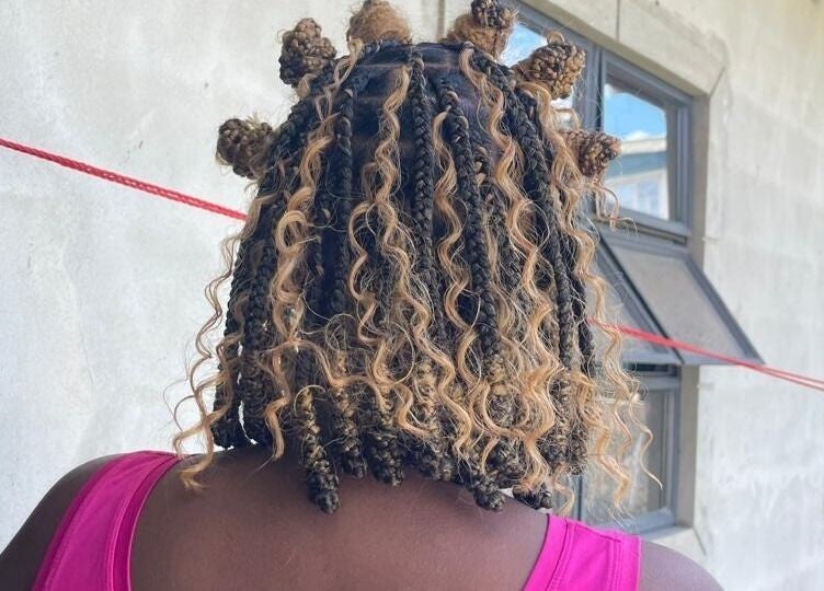 Unique curly hairstyle at The Slayhouse.gy, Golden Grove, East Bank Demerara, GY.