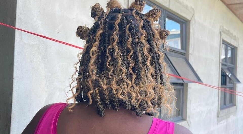Unique curly hairstyle at The Slayhouse.gy, Golden Grove, East Bank Demerara, GY.