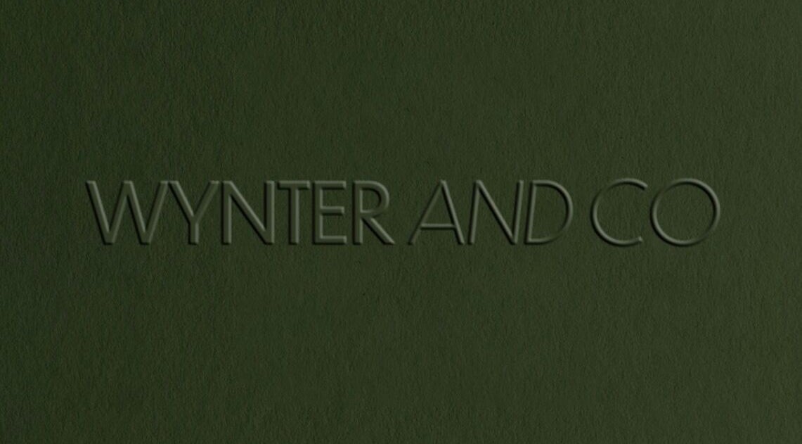 Wynter and Co logo on a textured green background in Newcastle upon Tyne, England, GB.
