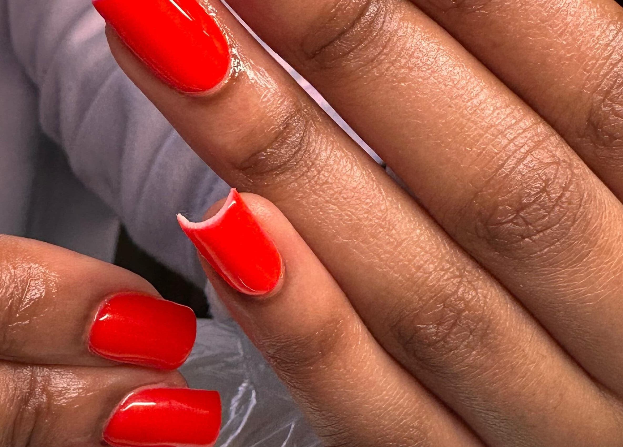 Bright red nails showcasing vibrant manicure at PinkyM Nails, Ennerdale, Gauteng, ZA.