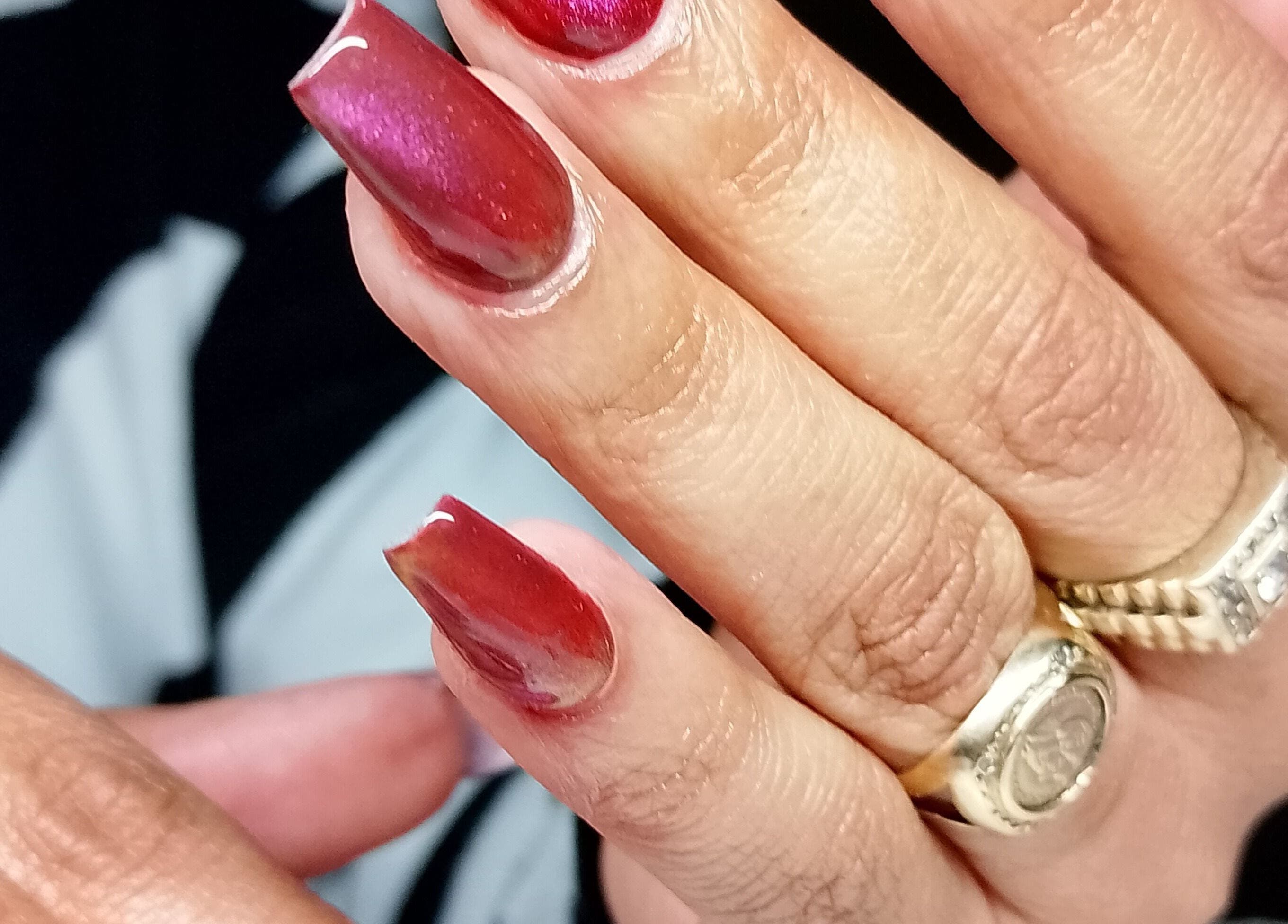 Stunning red nails at PinkyM nails, Ennerdale, Gauteng, ZA, showcasing expert manicure artistry.