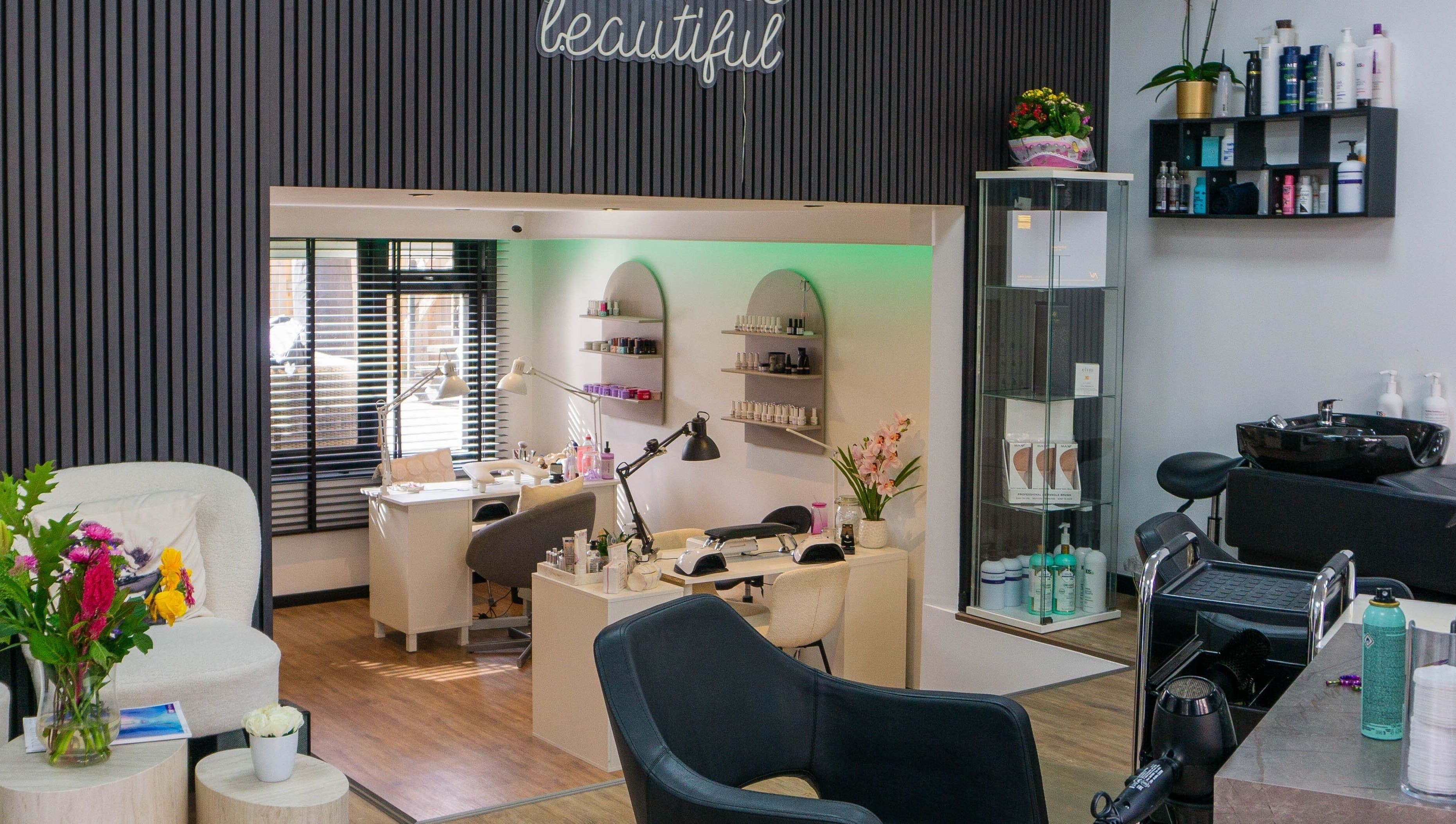 Stylish beauty salon interior at Metamorfosa, Utrecht, NL with modern decor and nail stations.