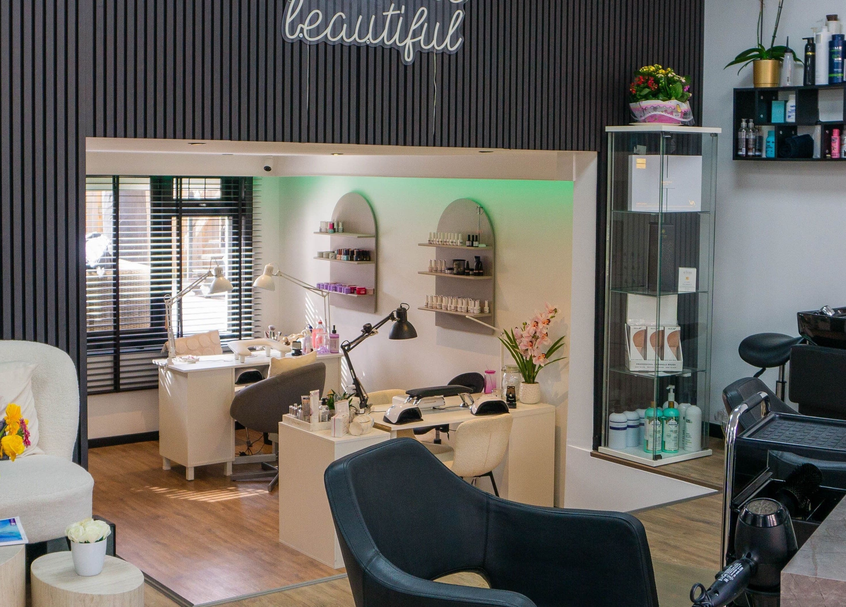 Stylish beauty salon interior at Metamorfosa, Utrecht, NL with modern decor and nail stations.