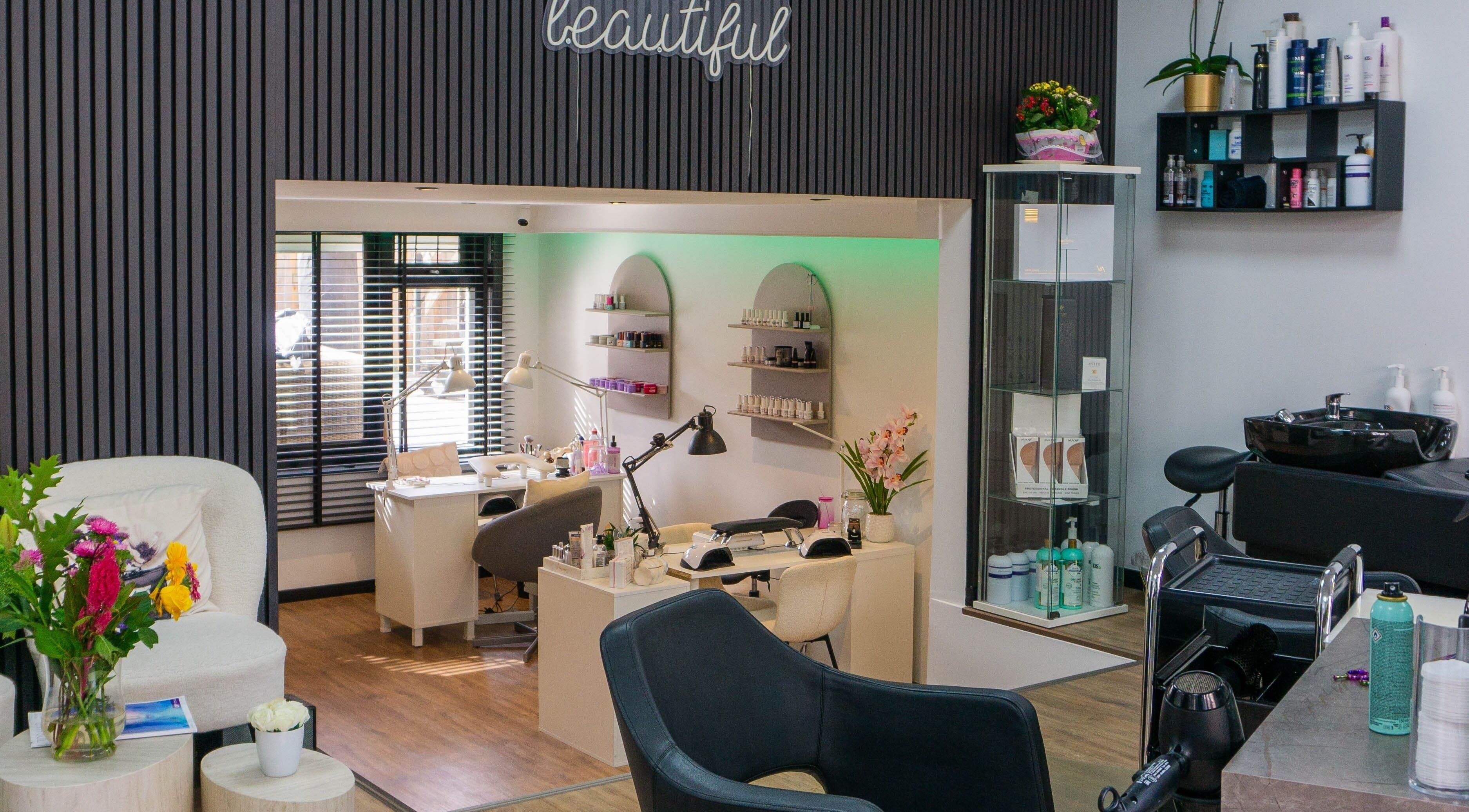 Stylish beauty salon interior at Metamorfosa, Utrecht, NL with modern decor and nail stations.