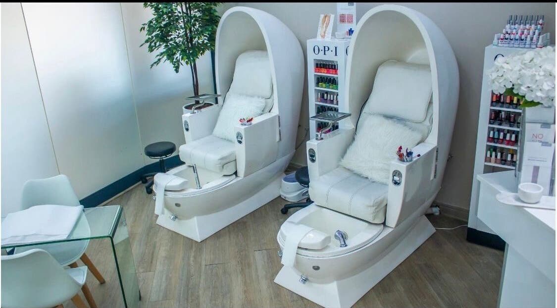 Elegant pedicure chairs at Ralph Chenelle, Sandton, Gauteng, ZA, showcasing plush comfort and modern spa design.