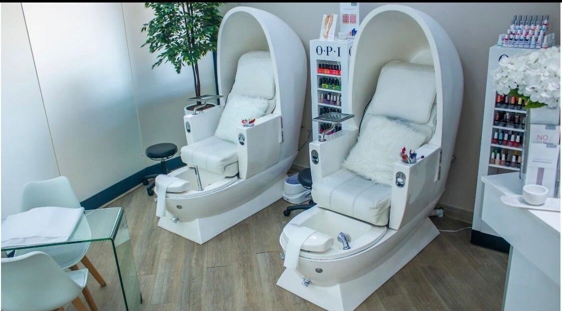 Elegant pedicure chairs at Ralph Chenelle, Sandton, Gauteng, ZA, showcasing plush comfort and modern spa design.