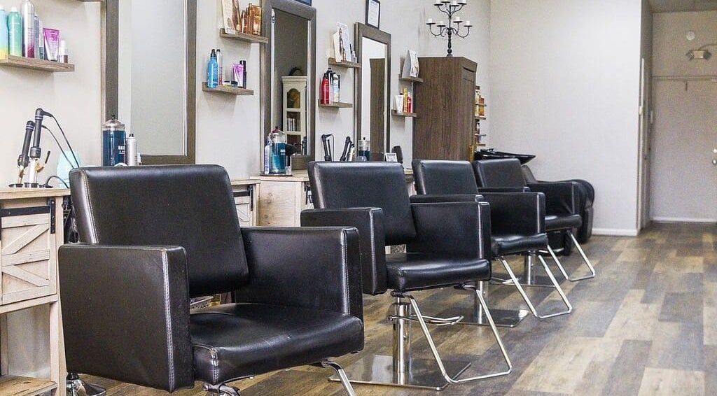 Modern styling chairs at Meraki Salon, Port St. Lucie, Florida, US, showcasing a sleek and inviting ambiance.