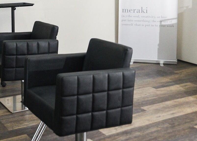 Elegant styling chairs at Meraki Salon, Port St. Lucie, Florida, US, offering a chic, relaxing atmosphere.
