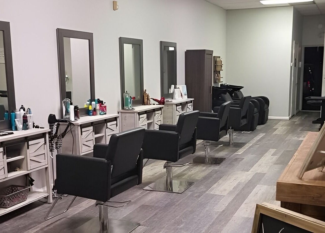 Spacious interior of Meraki Salon, Port St. Lucie, Florida, US, featuring sleek styling stations and modern decor.