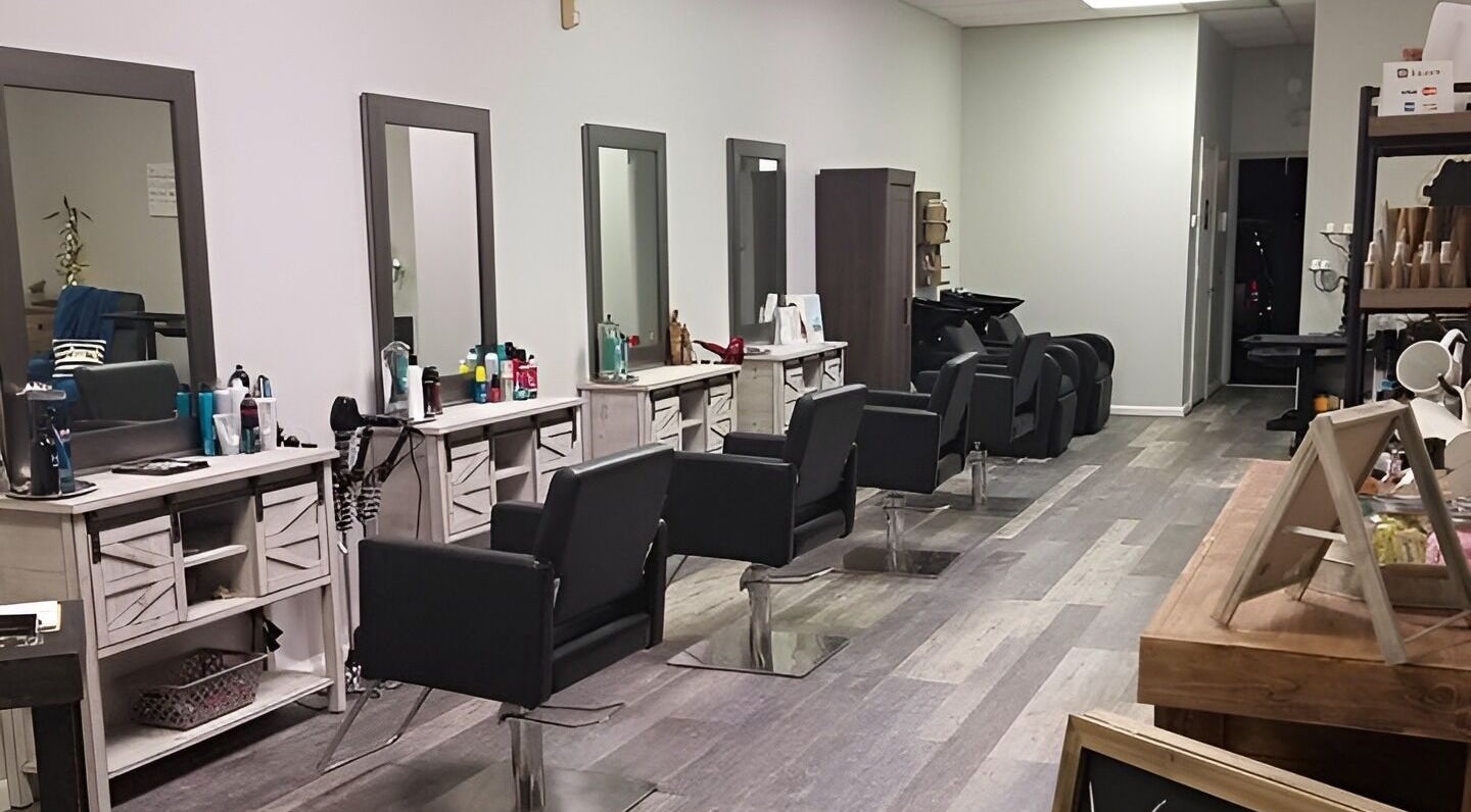 Spacious interior of Meraki Salon, Port St. Lucie, Florida, US, featuring sleek styling stations and modern decor.
