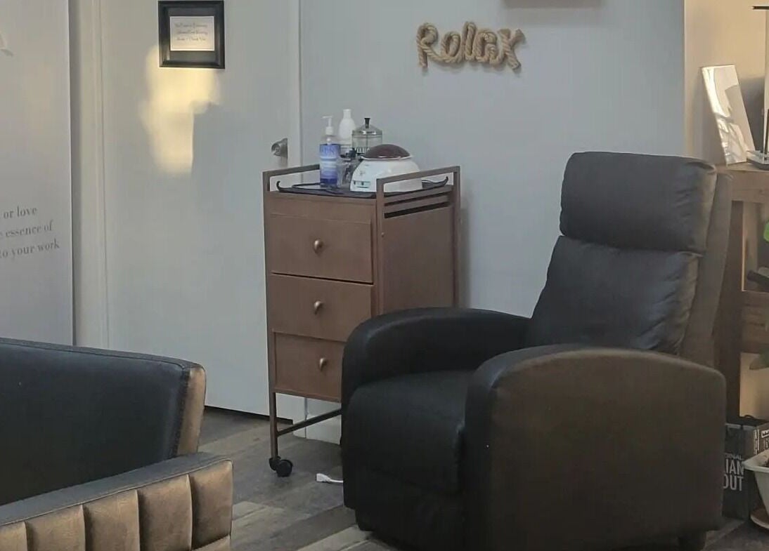 Cozy seating area at Meraki Salon in Port St. Lucie, Florida, US, featuring a comfy chair and stylish decor.