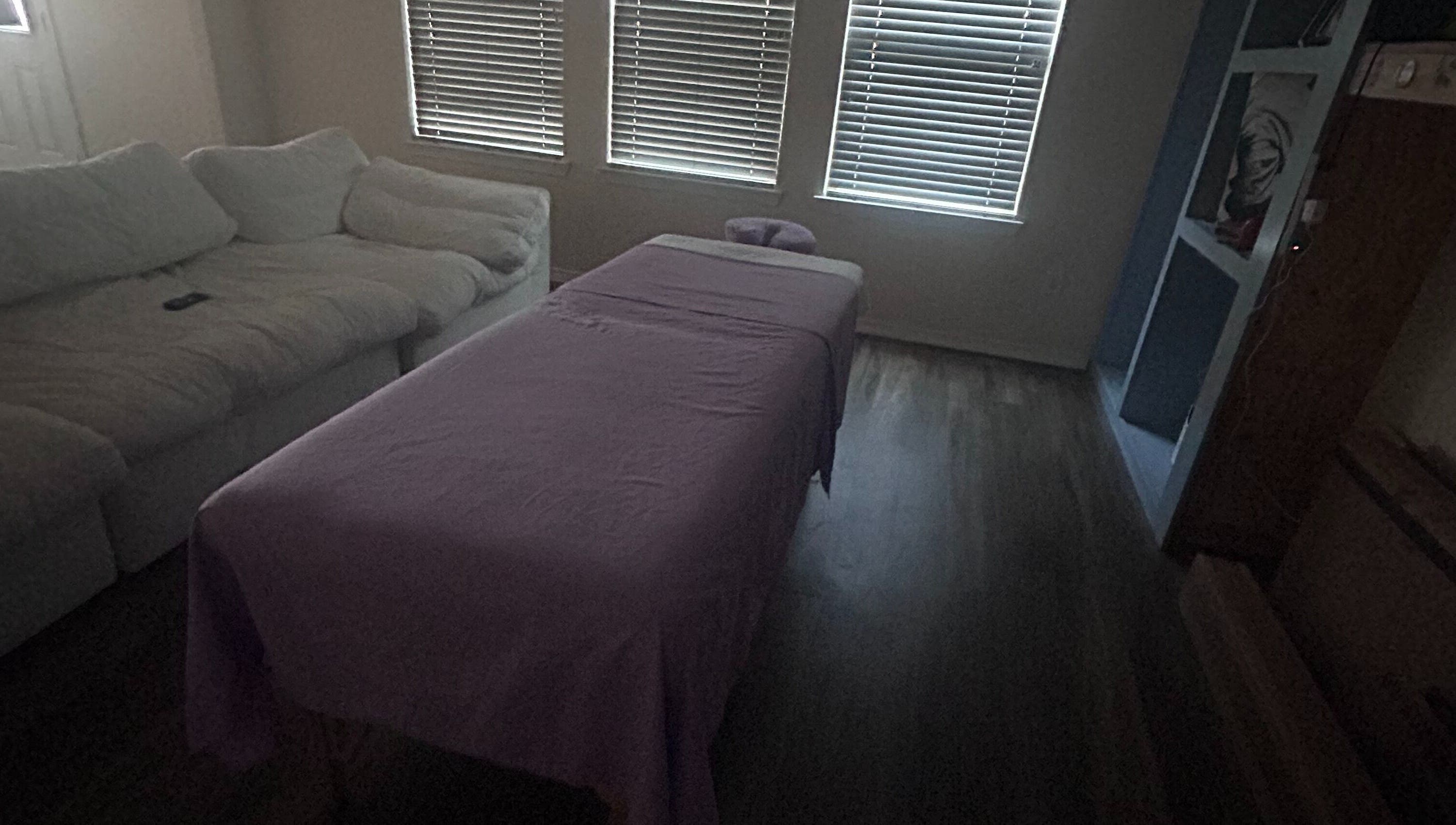 Relaxing massage setup at Mindful Motion Mobile Massage, US with cozy bed and serene ambiance.