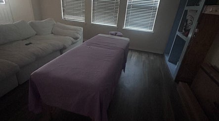 Relaxing massage setup at Mindful Motion Mobile Massage, US with cozy bed and serene ambiance.