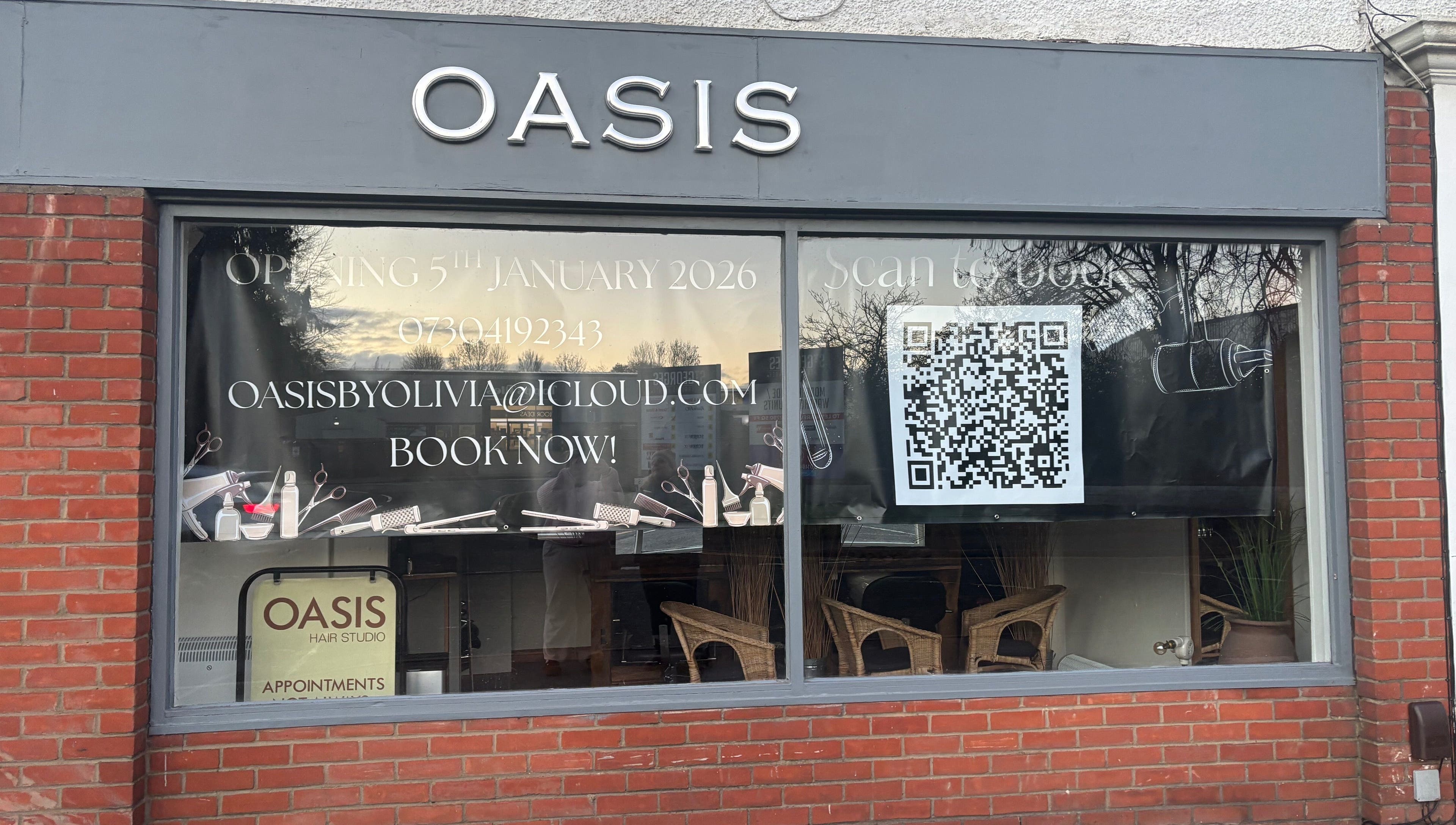 Front view of Oasis storefront in Amersham, England, GB, featuring booking details and a large QR code.