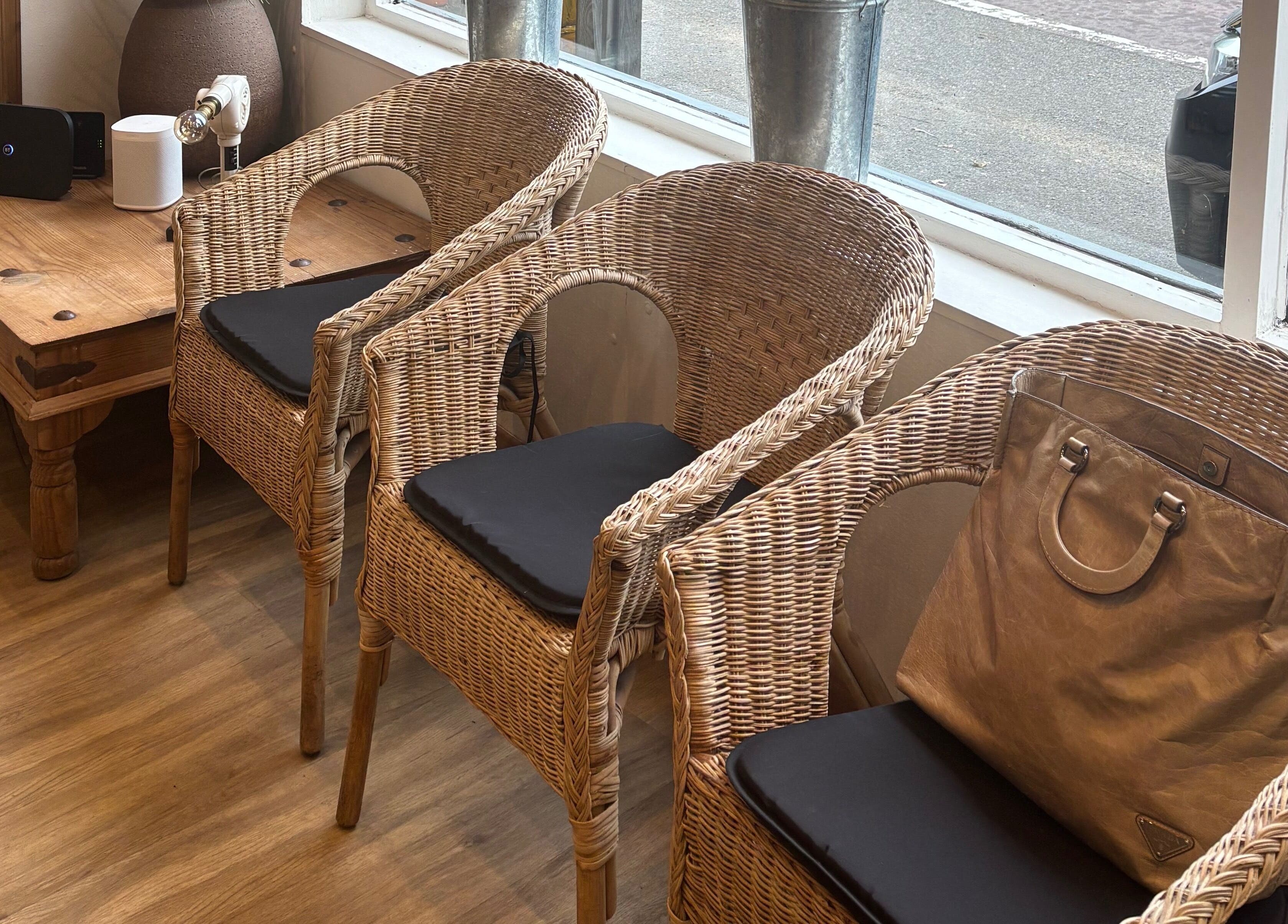 Cozy wicker seating arrangement at Oasis, Amersham, England, GB, perfect for relaxation and socializing.