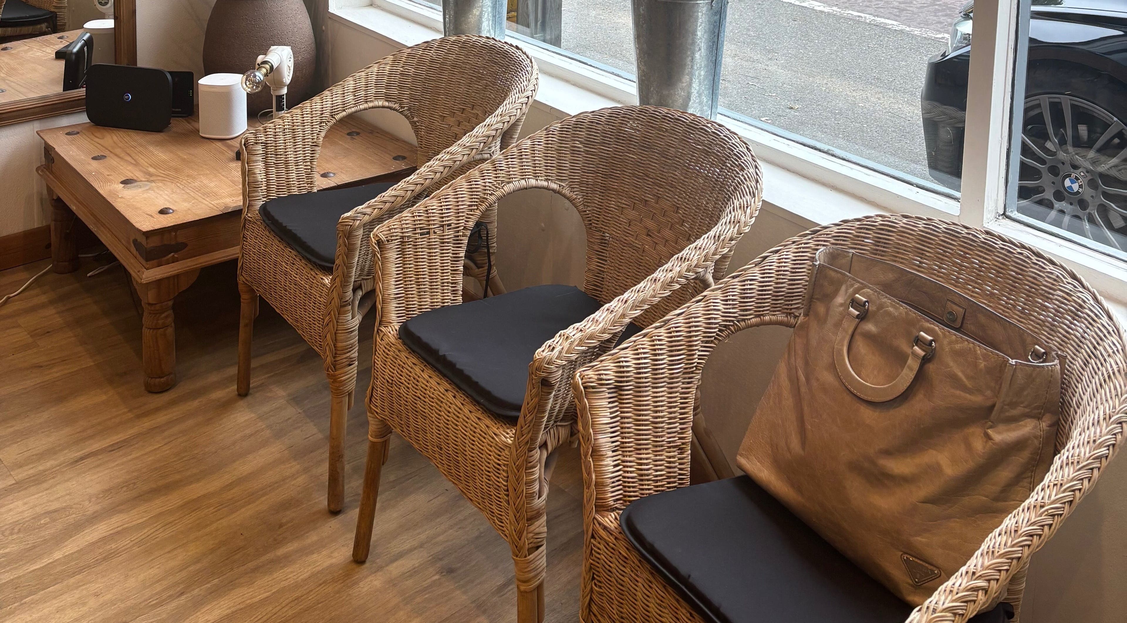 Cozy wicker seating arrangement at Oasis, Amersham, England, GB, perfect for relaxation and socializing.