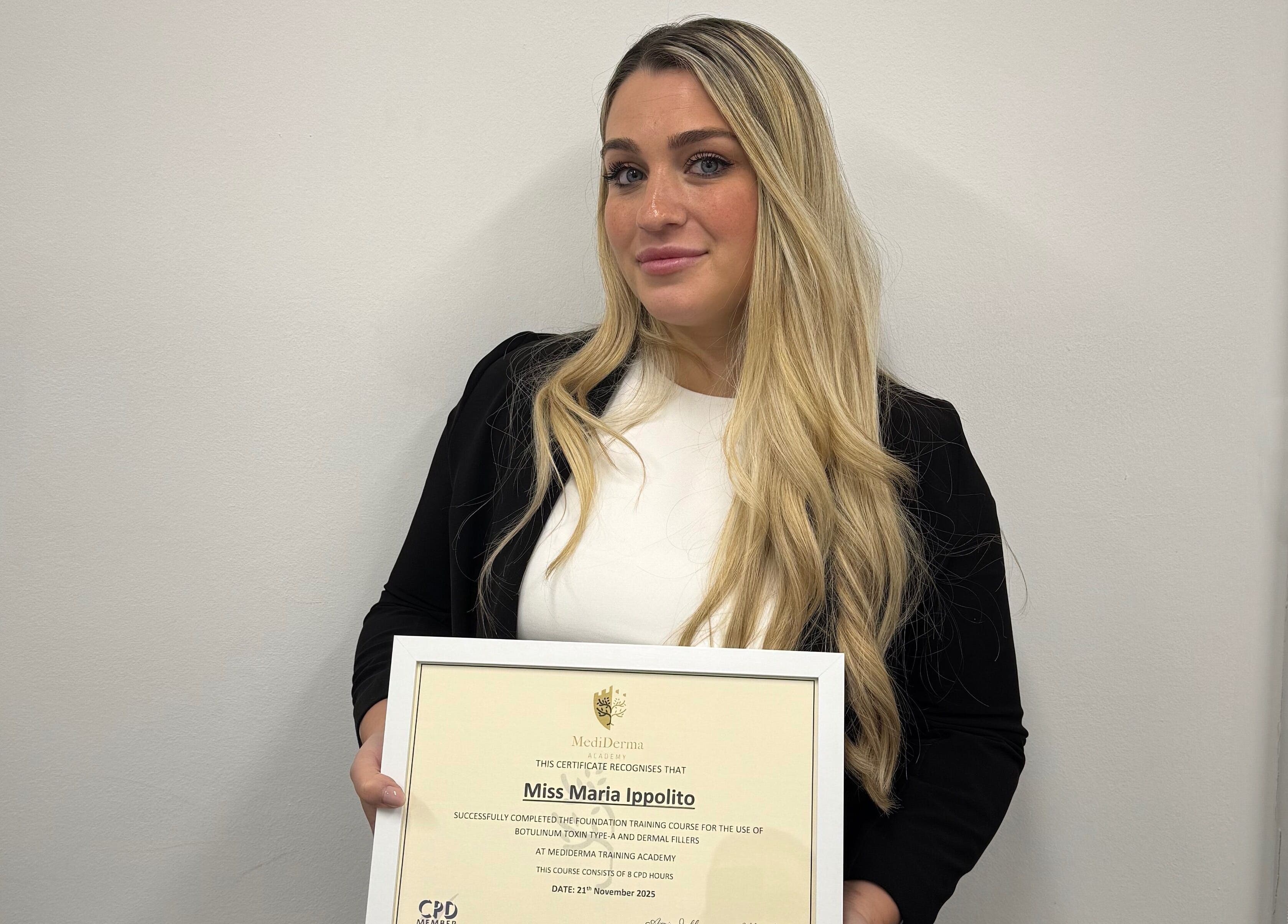Certified professional at MavenAesthetics, London, England, GB, proudly displaying her achievement certificate.