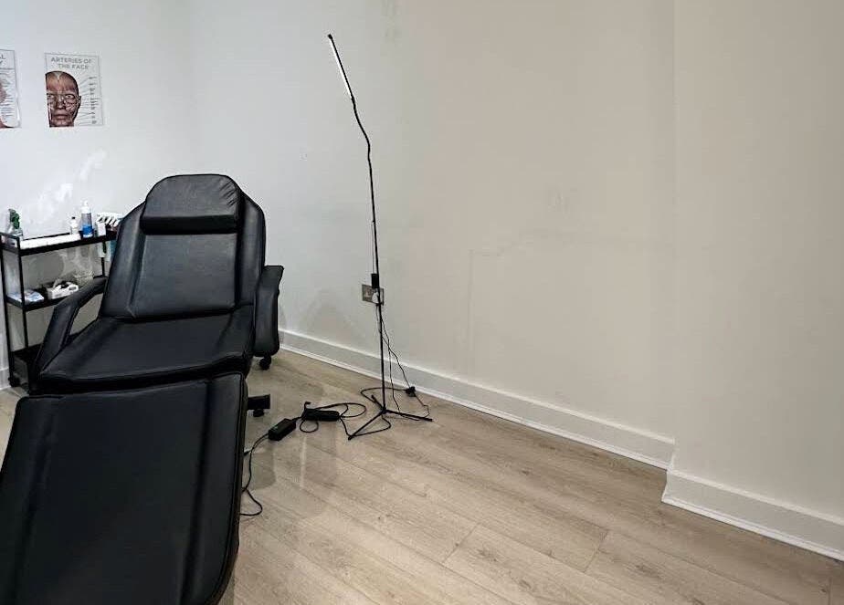 Treatment room with recliner at MavenAesthetics, London, England, GB, offering relaxing wellness services.