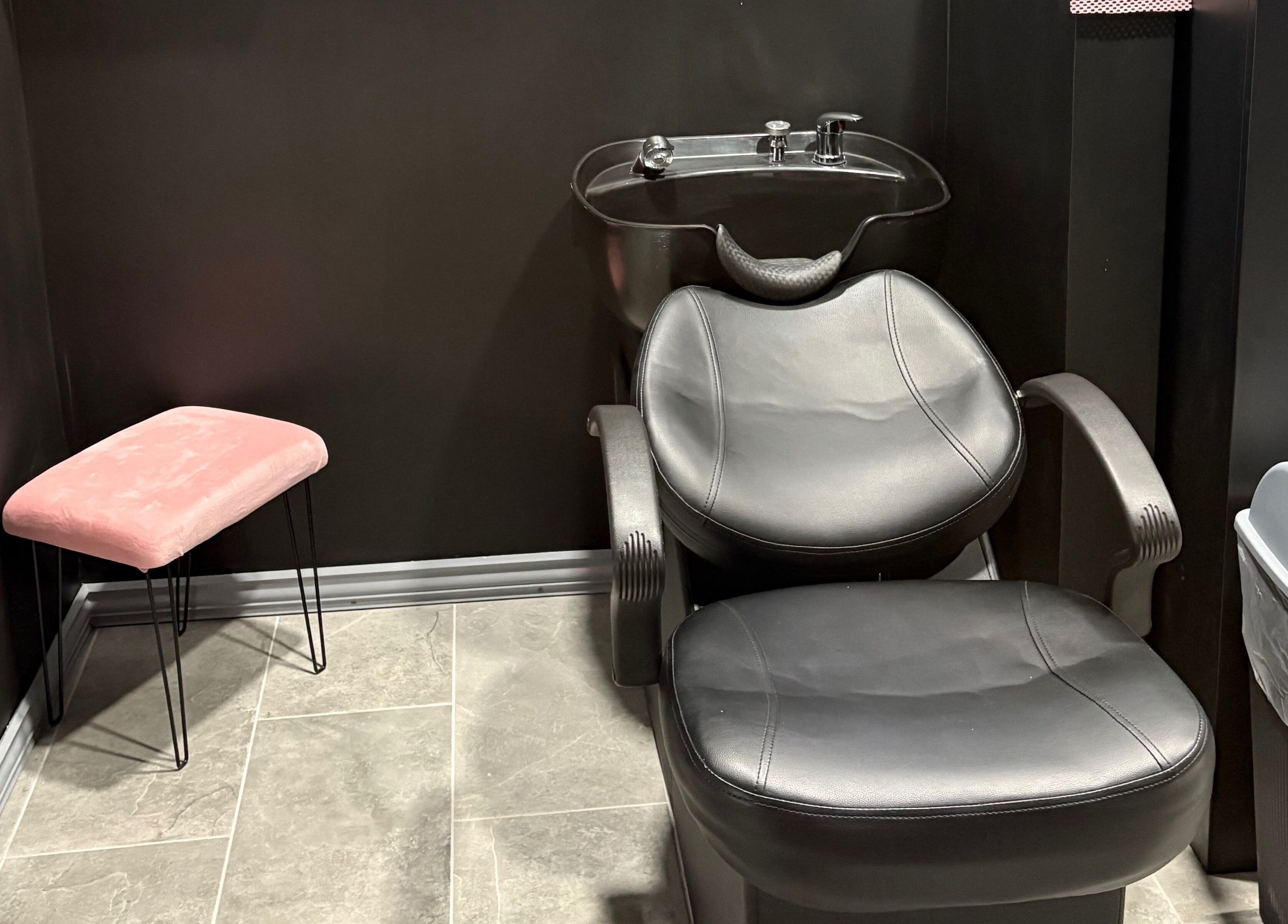 Stylish hair wash station at Contoured Crowns By Neky, Nassau, New Providence, BS. Modern salon interior.
