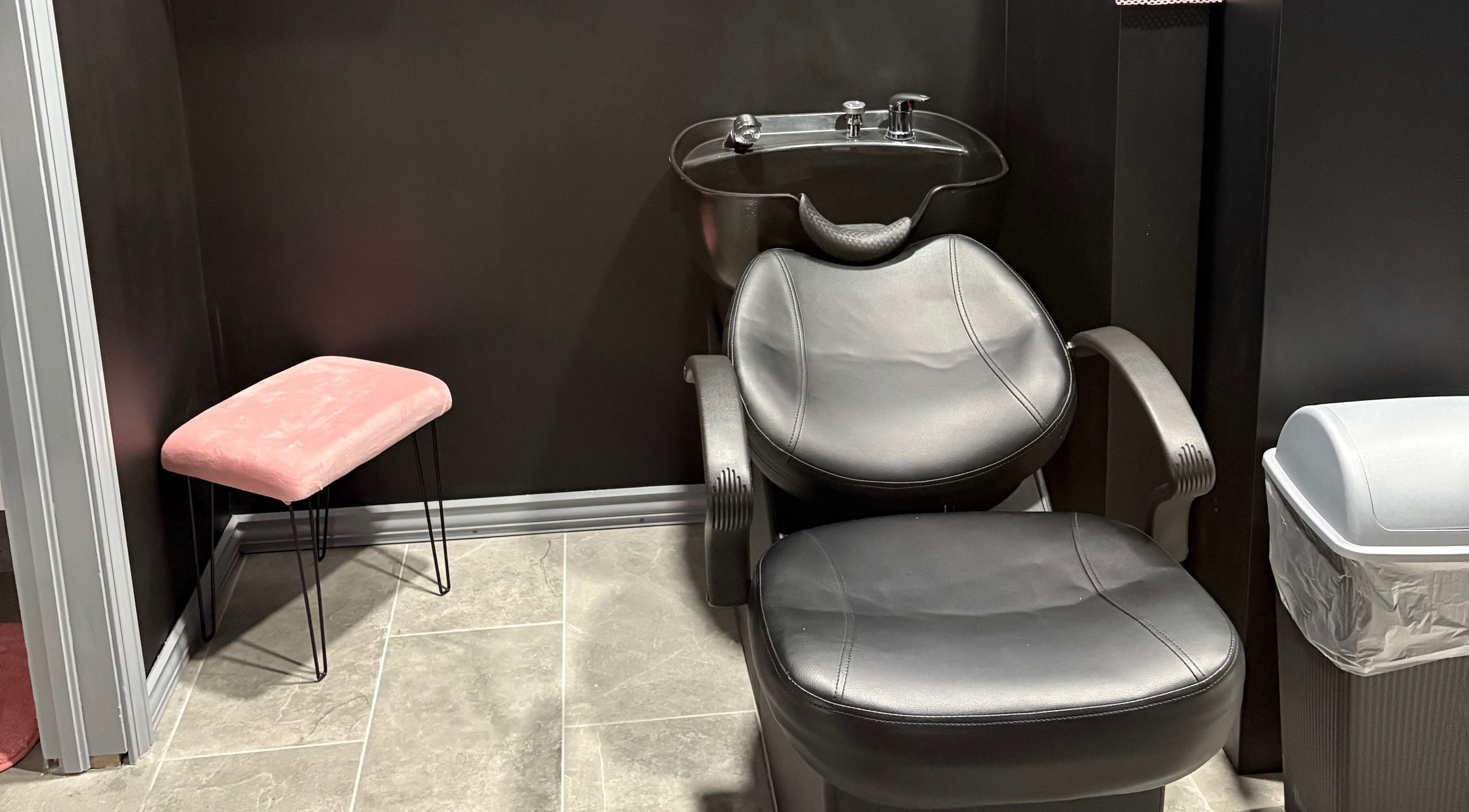 Stylish hair wash station at Contoured Crowns By Neky, Nassau, New Providence, BS. Modern salon interior.