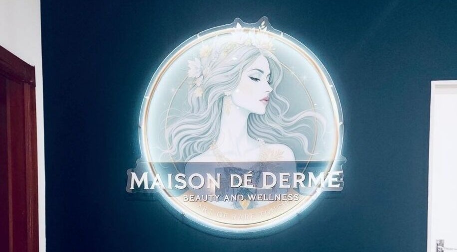 Elegant logo at Maison De Derme Beauty & Wellness, Benoni, Gauteng, ZA. Aesthetic decor with serene artwork.