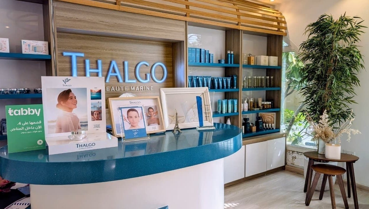 Reception area of Villa Thalgo - Dubai, showcasing luxury skincare displays and elegant decor in Dubai, AE.
