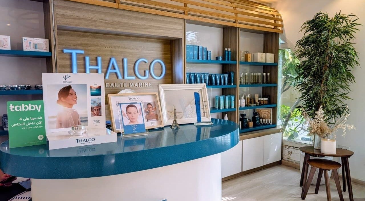 Reception area of Villa Thalgo - Dubai, showcasing luxury skincare displays and elegant decor in Dubai, AE.