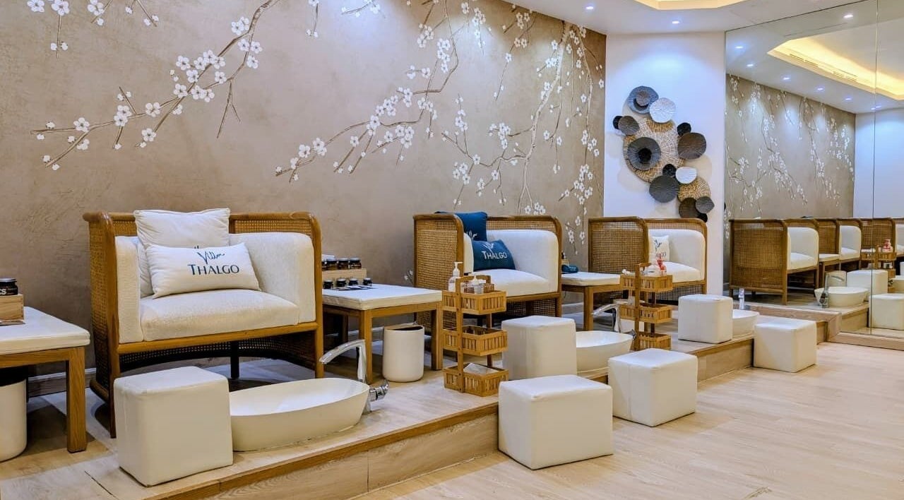 Elegant seating area at Villa Thalgo - Dubai featuring plush chairs and artistic decor, Dubai, AE.