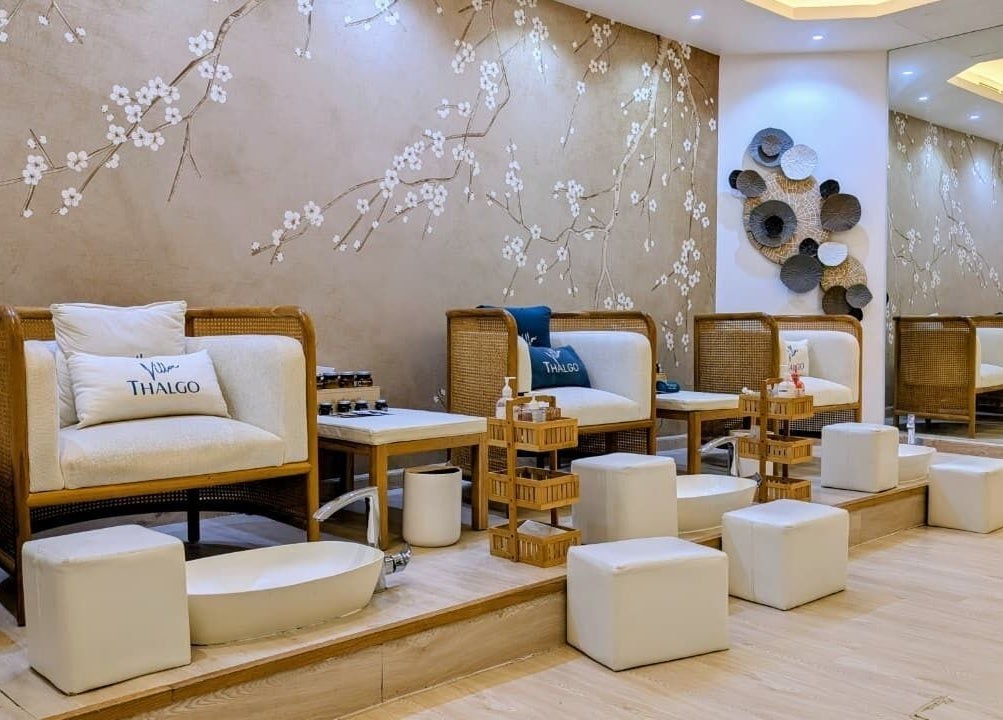 Elegant pedicure area at Villa Thalgo - Dubai, featuring plush seating and serene decor in Dubai, AE.
