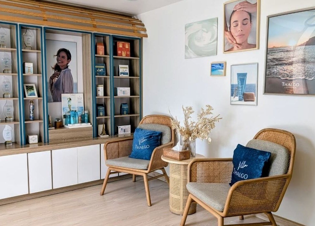 Elegant waiting area at Villa Thalgo - Dubai, featuring cozy seating and awards display. Dubai, AE.