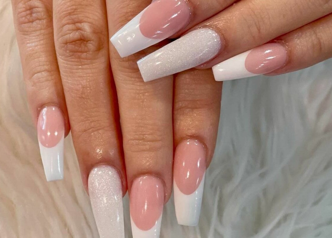 Stylish pink and white nails at Glo Nails, Houston, Texas, US. Perfect for chic manicures.
