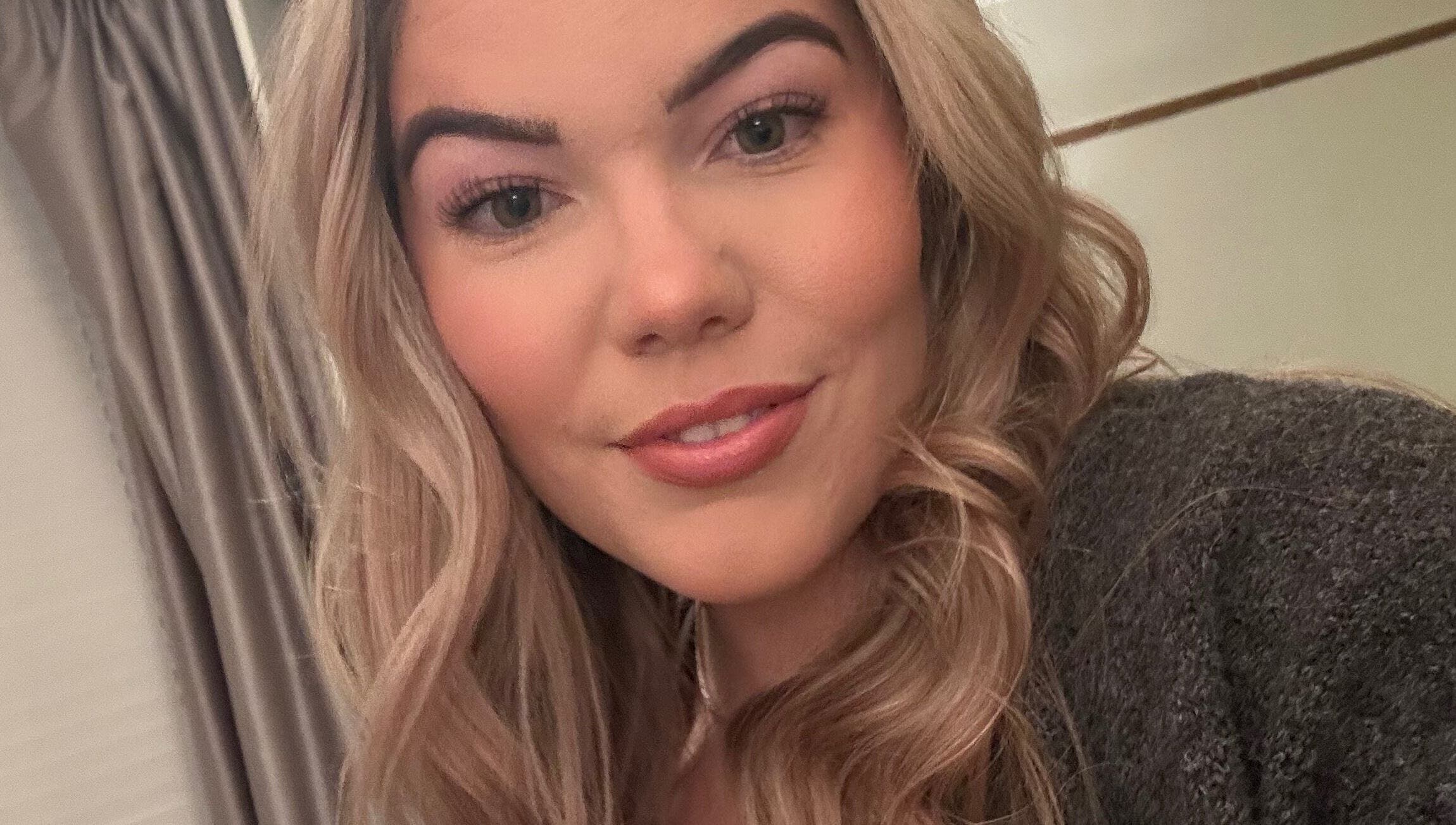 Smiling person with styled hair at Livs Brow Studio, Earlswood, England, GB.