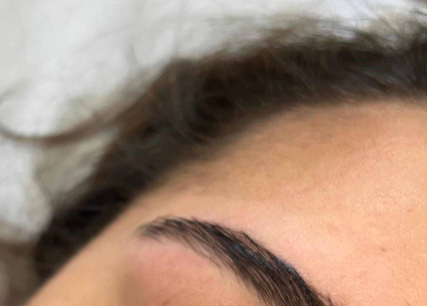 Close-up of expertly shaped eyebrows at Livs Brow Studio, Earlswood, England, GB showcasing precision beauty.