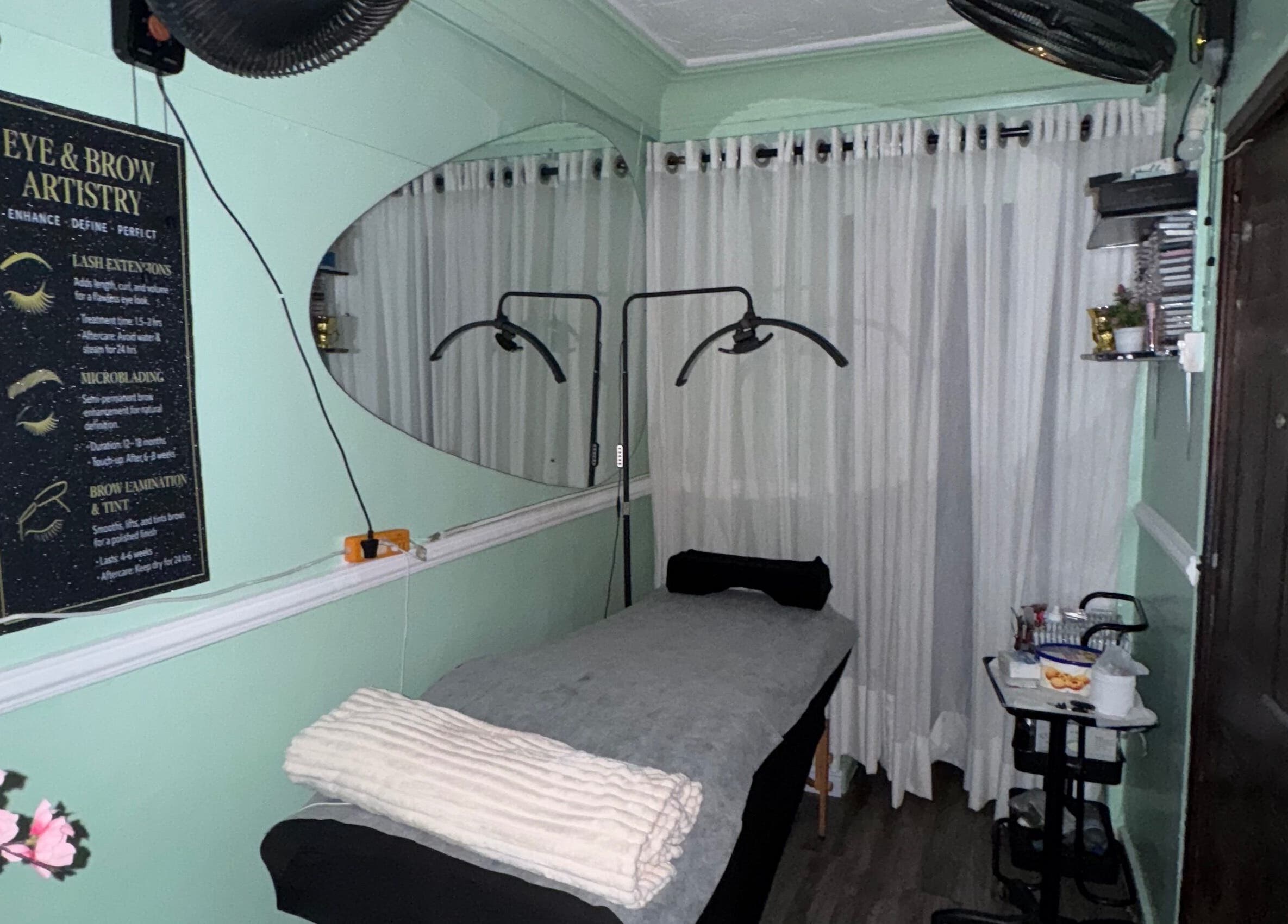 Relaxing treatment room at Demeerahs place in Lekki, Lagos, NG with soft lighting and plush bedding.
