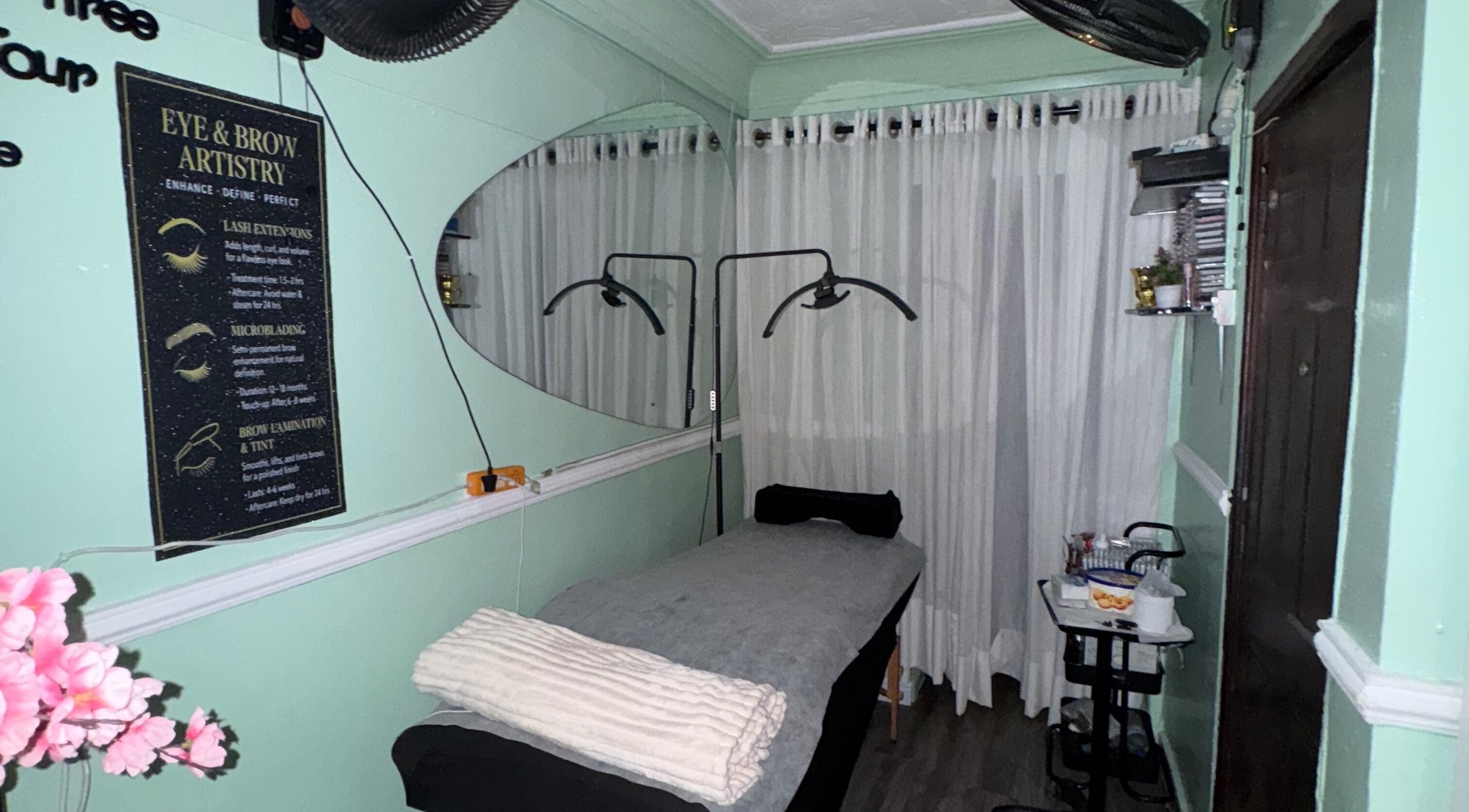 Relaxing treatment room at Demeerahs place in Lekki, Lagos, NG with soft lighting and plush bedding.